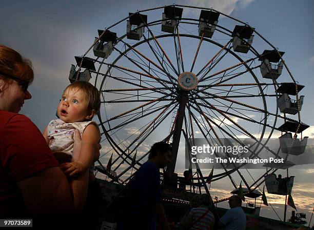 Thomas Jefferson Community Center, Arlington, VA A wide-eyed 11-month-old Julia Rose Gulino held by her mom Ryann Gulino, of Fredericksburg, Va., at...