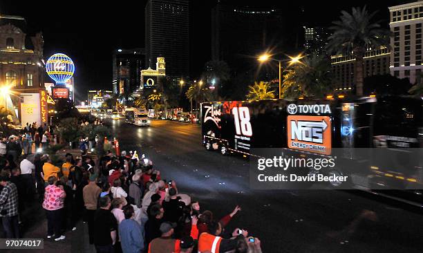 Racing fans cheers as NASCAR car haulers parade down the Las Vegas Strip Thursday, February 25, 2010 in Las Vegas, Nevada. Racers will compete in the...