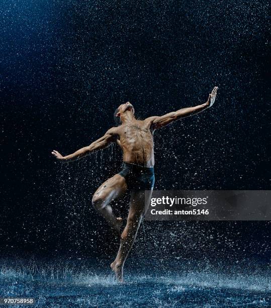 athletic ballet dancer performing with water - barefoot black men stock pictures, royalty-free photos & images