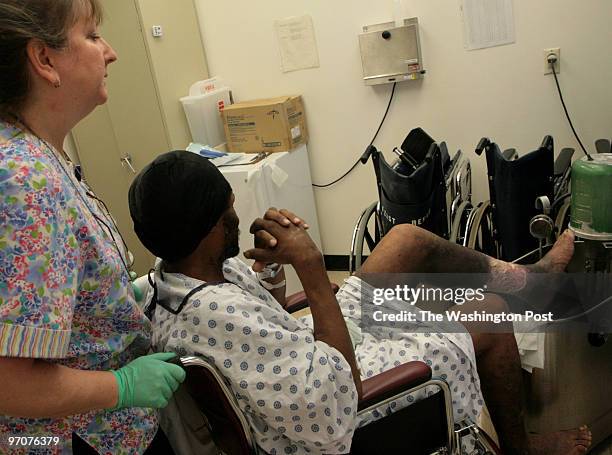 Washington, DC, SE Pictured, physical therapist Kathy Faas works with patient Maurice Milline in the outpatient unit during a tour of the Greater...