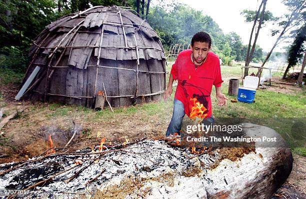 June 29, 2007 CREDIT: Mark Gail/ TWP St. Leonard, Md ASSIGNMENT# :192100 EDITED: mg Fourteen year-old Joshua Mason blew on the flames to keep them...