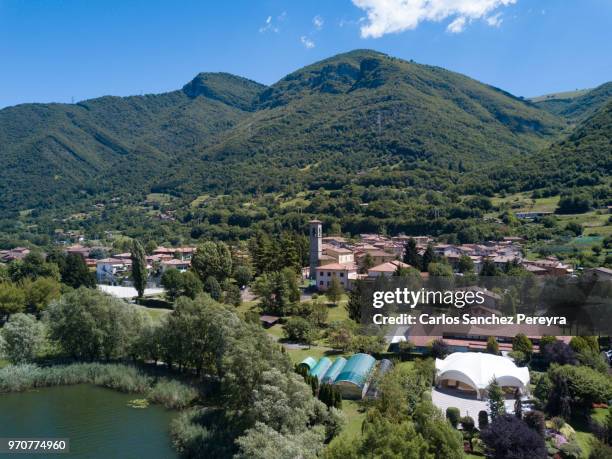 panoramic view of the lake - monasterolo del castello stock pictures, royalty-free photos & images