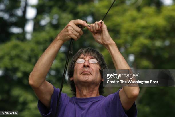 June 23, 2007 CREDIT: Carol Guzy/ The Washington Post Fairfax Station VA Bob Bowis helps men put up antennae equipment. Members of the Vienna...