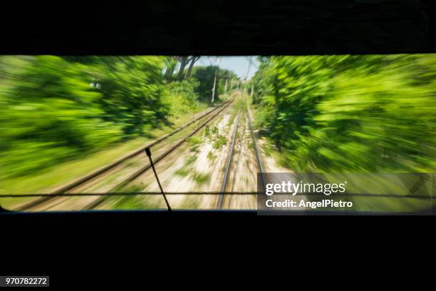 zooming train - miguelangelortega stock pictures, royalty-free photos & images