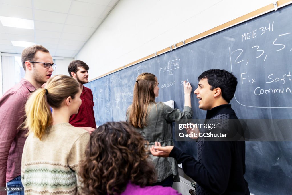 Group Of Students Having Discussion At Their Classroom High-Res Stock ...