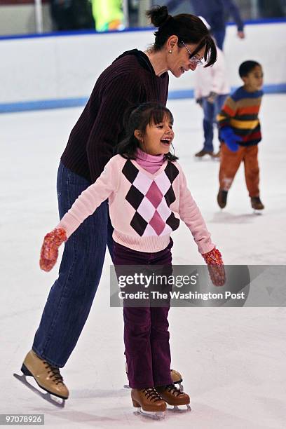 At the Wheaton Regional Park Ice Rink. Pictured, Johanna Arnjona of Bethesda, enjoys a spin on the ice with her mother, Dolores.