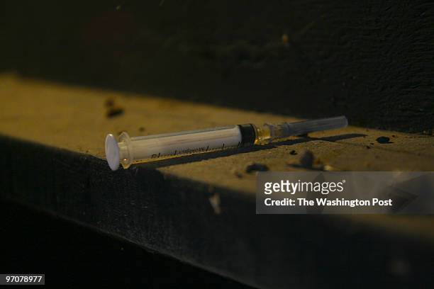 VickHouse DATE: December 9, 2007 CREDIT: Carol Guzy/The Washington Post Smithfield VA A syringe lies on a ledge of a kennel in a shed stained all...