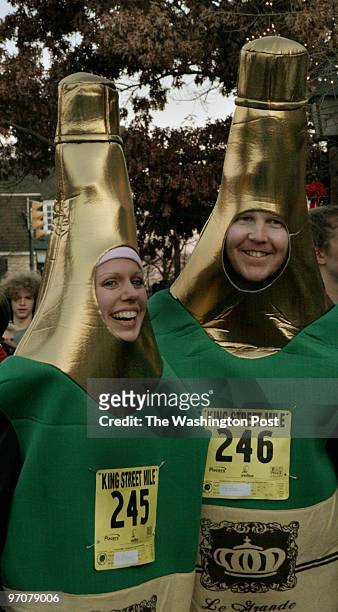 Alexandria, Virginia INFO: Emily and Peter Wallace of Arlington, Virginia, donned champagne bottle costumes to run the inaugural one mile sprint up...