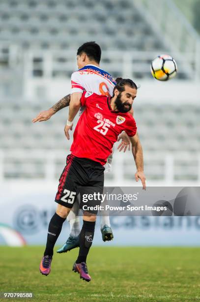 Hugo Silva of Benfica Macau fights for the ball with Song Jong Hyok of Hwaepul SC during the AFC Cup Group I match between Benfica Macau and Hwaepul...