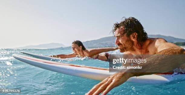 wave surfing in sea - extreme depth of field stock pictures, royalty-free photos & images