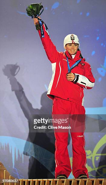 Elisabeth Goergl of Austria celebrates receiving the bronze medal during the medal ceremony for the women's giant slalom alpine skiing on day 14 of...