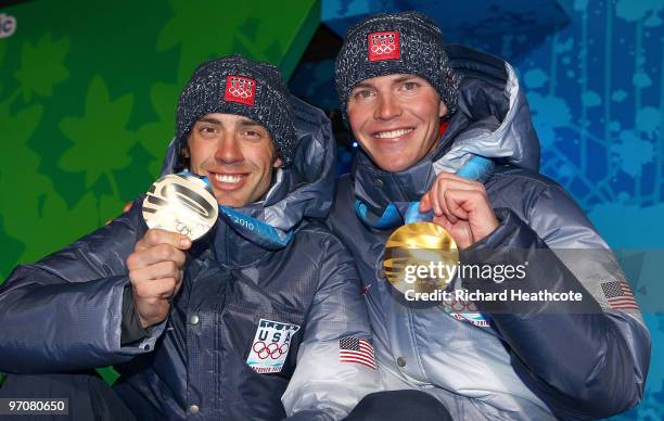 Johnny Spillane of the United States receives the silver medal and Bill Demong of the United States receives the gold medal during the medal ceremony...