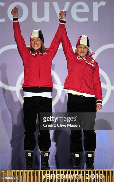 Heather Moyse and Kaillie Humphries of Canada celebrate receiving the gold medal during the medal ceremony for the women's bobsleigh on day 14 of the...