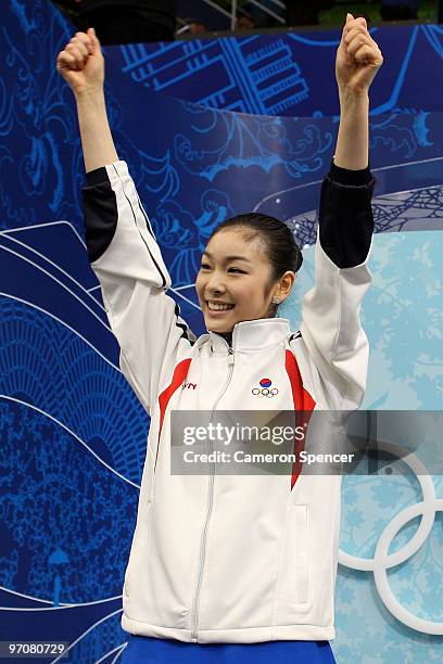 Kim Yu-Na of South Korea celebrates her score in the kiss and cry area in the Ladies Free Skating on day 14 of the 2010 Vancouver Winter Olympics at...