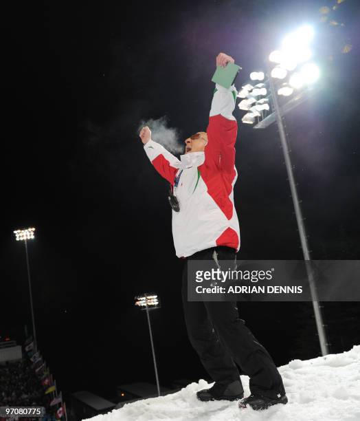 The Belarus Coach reacts after Alexei Grishin wins the men's Freestyle Skiing aerials final at Cypress Mountain, north of Vancouver on February 25,...