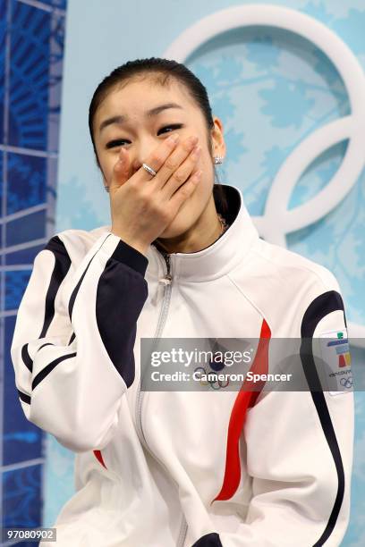 Kim Yu-Na of South Korea reacts to her score in the kiss and cry area in the Ladies Free Skating on day 14 of the 2010 Vancouver Winter Olympics at...