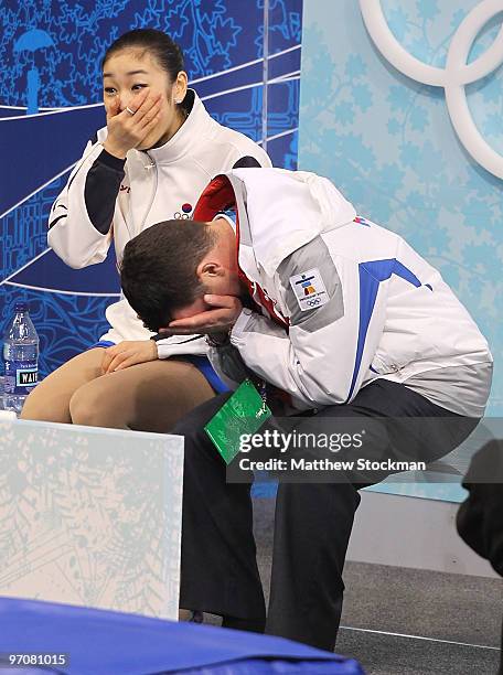 Kim Yu-Na of South Korea celebrates her score in the kiss and cry area with coach Brian Orser in the Ladies Free Skating on day 14 of the 2010...