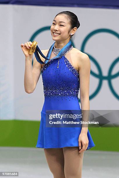 Kim Yu-Na of South Korea celebrates winning the gold medal in the Ladies Free Skating during the medal ceremony on day 14 of the 2010 Vancouver...