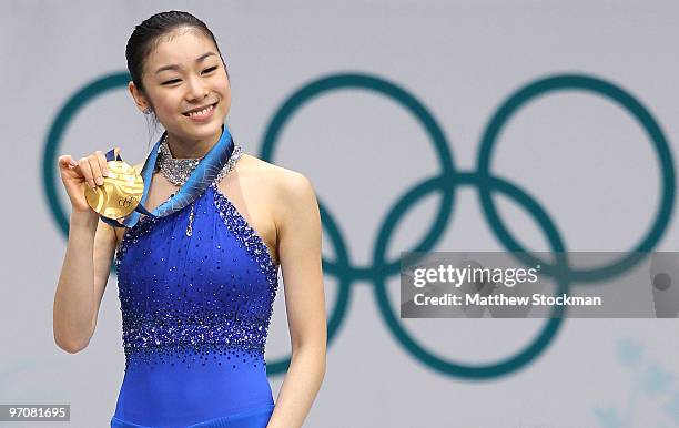 Kim Yu-Na of South Korea celebrates winning the gold medal in the Ladies Free Skating during the medal ceremony on day 14 of the 2010 Vancouver...