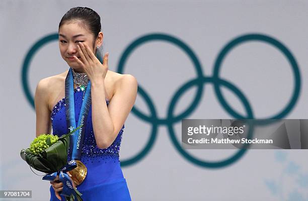 Kim Yu-Na of South Korea celebrates winning the gold medal in the Ladies Free Skating during the medal ceremony on day 14 of the 2010 Vancouver...