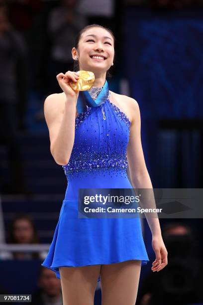 Kim Yu-Na of South Korea celebrates winning the gold medal in the Ladies Free Skating during the medal ceremony on day 14 of the 2010 Vancouver...