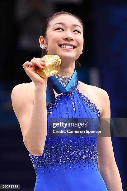 Kim Yu-Na of South Korea celebrates winning the gold medal in the Ladies Free Skating during the medal ceremony on day 14 of the 2010 Vancouver...