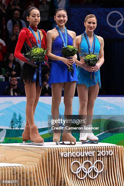 Mao Asada of Japan receives the silver medal, Kim Yu-Na of South Korea receives the gold medal and Joannie Rochette of Canada receives the bronze...