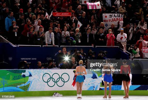 Mao Asada of Japan receives the silver medal, Kim Yu-Na of South Korea receives the gold medal and Joannie Rochette of Canada receives the bronze...