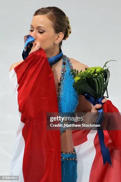 Joannie Rochette of Canada kisses her bronze medal in the Ladies Free Skating during the medal ceremony on day 14 of the 2010 Vancouver Winter...