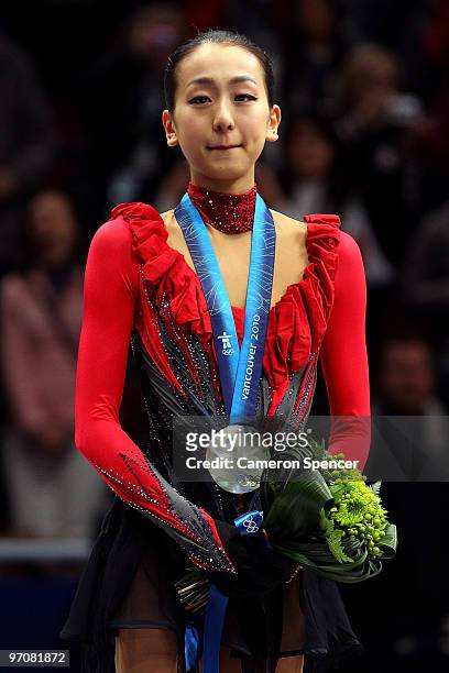 Mao Asada of Japan receives the silver medal during the medal ceremony for the Ladies Free Skating on day 14 of the 2010 Vancouver Winter Olympics at...