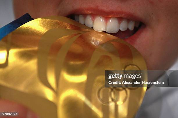 Viktoria Rebensburg of Germany poses with the gold medal for the women's giant slalom alpine skiing on day 14 of the Vancouver 2010 Winter Olympics...