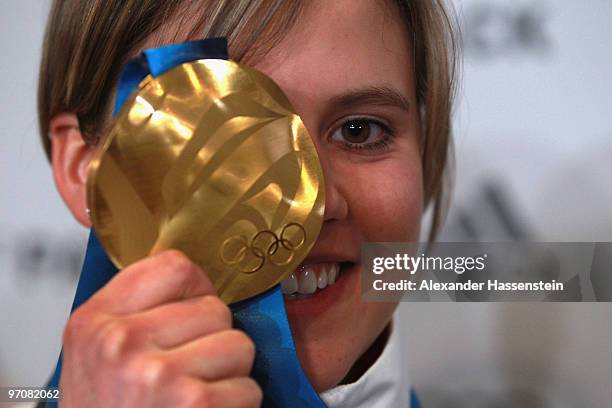 Viktoria Rebensburg of Germany poses with the gold medal for the women's giant slalom alpine skiing on day 14 of the Vancouver 2010 Winter Olympics...