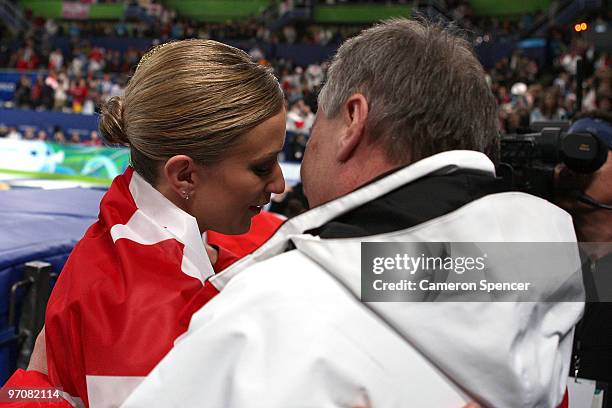 Joannie Rochette of Canada reacts with her father Normand in the Ladies Free Skating on day 14 of the 2010 Vancouver Winter Olympics at Pacific...