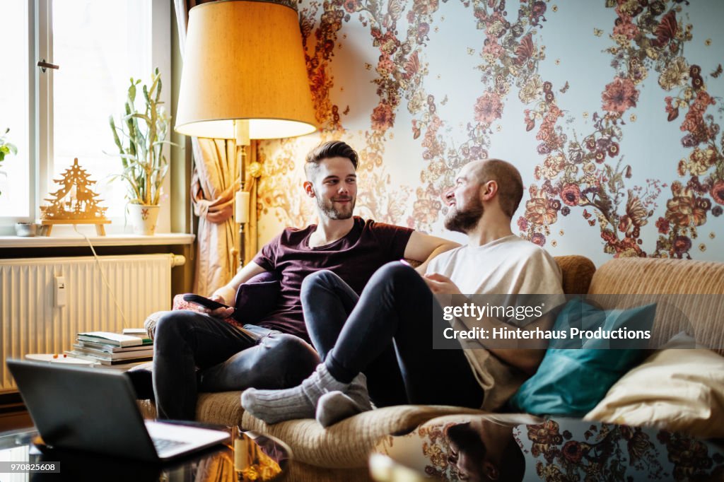Gay Couple Chatting Wile Watching TV