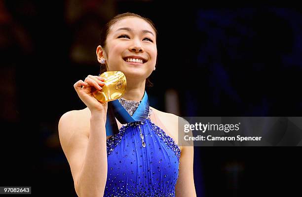 Kim Yu-Na of South Korea celebrates winning the gold medal in the Ladies Free Skating during the medal ceremony on day 14 of the 2010 Vancouver...