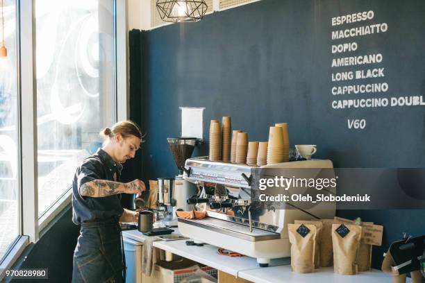 barista brewing coffee with coffee machine - getting ready stock pictures, royalty-free photos & images