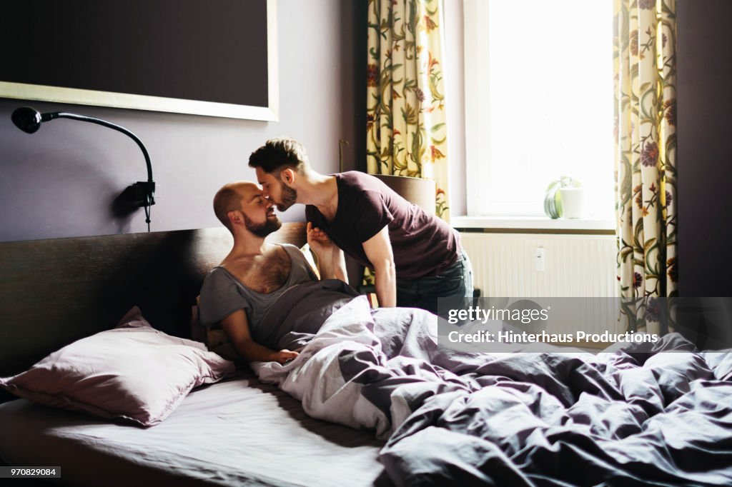 Man Kissing His Partner Before Leaving For Work