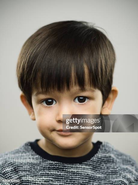 real bored kid looking at camera - brown eyes stock pictures, royalty-free photos & images