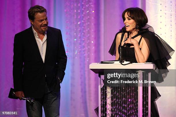 Actor Eddie Izzard and host Parker Posey speak onstage at the 12th Annual Costume Designers Guild Awards with Presenting Sponsor Swarovski held at...