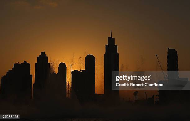 Water jets spray out of the The Dubai Fountain on February 25, 2010 in Dubai, United Arab Emirates. Set on the 30-acre Burj Dubai Lake, the fountain...