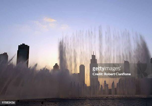 Water jets spray out of the The Dubai Fountain on February 25, 2010 in Dubai, United Arab Emirates. Set on the 30-acre Burj Dubai Lake, the fountain...