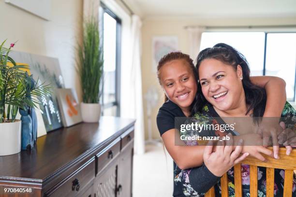 mother and daughter bonding. - polynesian culture stock pictures, royalty-free photos & images