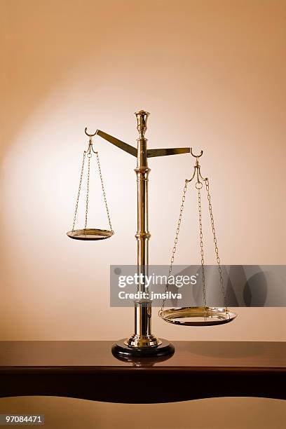 scale of justice - imbalance stock pictures, royalty-free photos & images