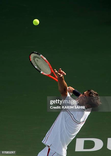 Marin Cilic of Croatia serves to Austria's Jurgen Melzer during their quarter-final match on the fourth day of the two-million-dollar ATP Dubai Open...