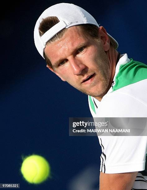 Austria's Jurgen Melzer returns to Marin Cilic of Croatia during their quarter-final match on the fourth day of the two-million-dollar ATP Dubai Open...