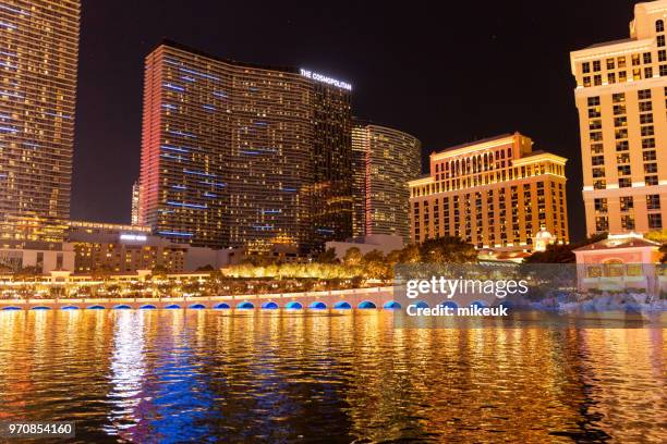 classic street scene from las vegas city, nevada with the cosmopolitan hotel building featured in the skyline - nevada skyline stock pictures, royalty-free photos & images