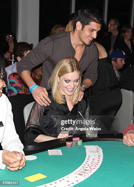 Actors Nicholas Gonzalez and Shanna Moakler participate in the 'Get Lucky for Lupus' celebrity charity poker tournament at Andaz West Hollywood on...