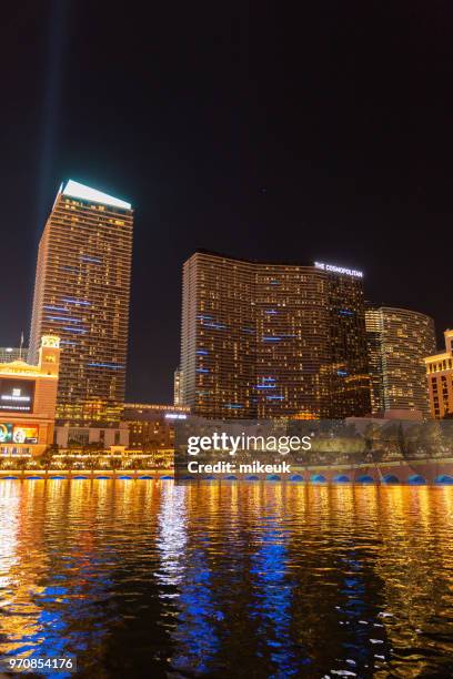 classic street scene from las vegas city, nevada with the cosmopolitan hotel building featured in the skyline - nevada skyline stock pictures, royalty-free photos & images