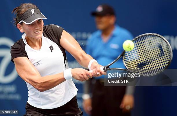 Chanelle Scheepers of Russia hits a return to Ayumi Morita of Japan of Russia during their quater final of the WTA Malaysian Open 2010 Tennis...