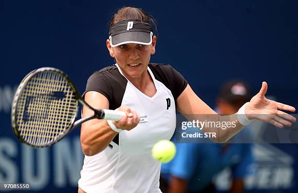 Chanelle Scheepers of Russia returns a shot to Ayumi Morita of Japan during their quater final match of the WTA Malaysian Open 2010 Tennis...